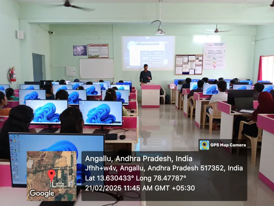 Students taking part in a computer lab session with projected learning material